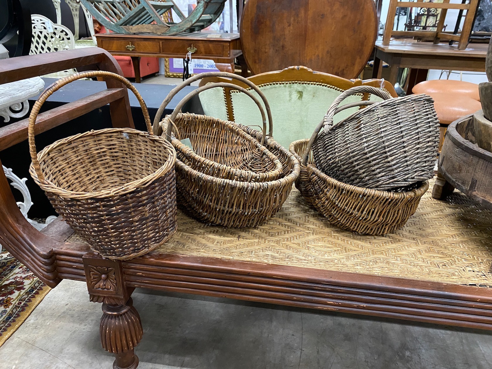 Five wicker baskets, largest length 53cm